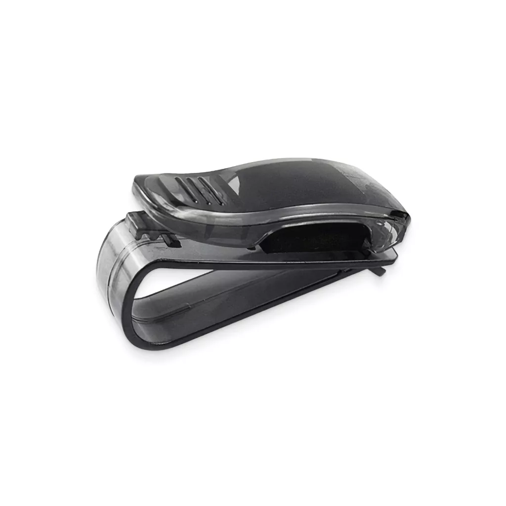 A black plastic clip with a curved design, used for holding items such as sunglasses or documents. The clip features a transparent black top and has a sleek, compact shape suitable for attaching to a vehicle sun visor.