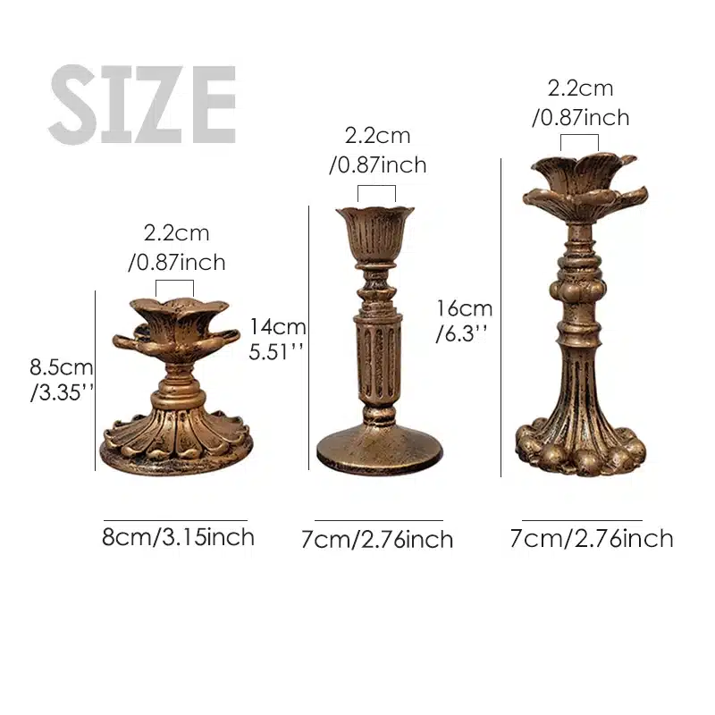 Three bronze-colored candlestick holders in varying heights and styles. Left: short with floral design (8cm/3.15in), middle: taller and slender (7cm/2.76in), right: medium height with ornate base (7cm/2.76in). All tops are 2.2cm/0.87in wide.